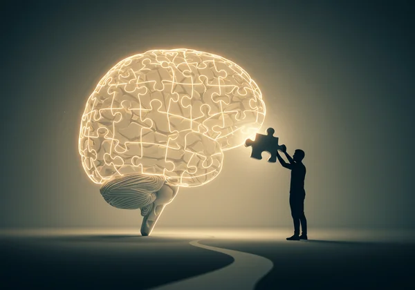 Person looking at a glowing brain puzzle, a signpost.